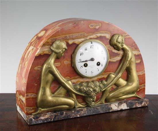 A French Art Deco rouge marble and bronze mantel clock, 10in.
